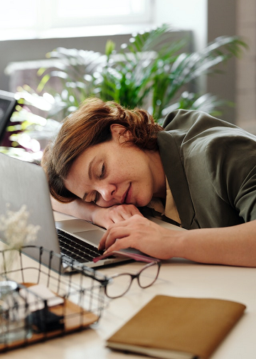 woman asleep at her desk